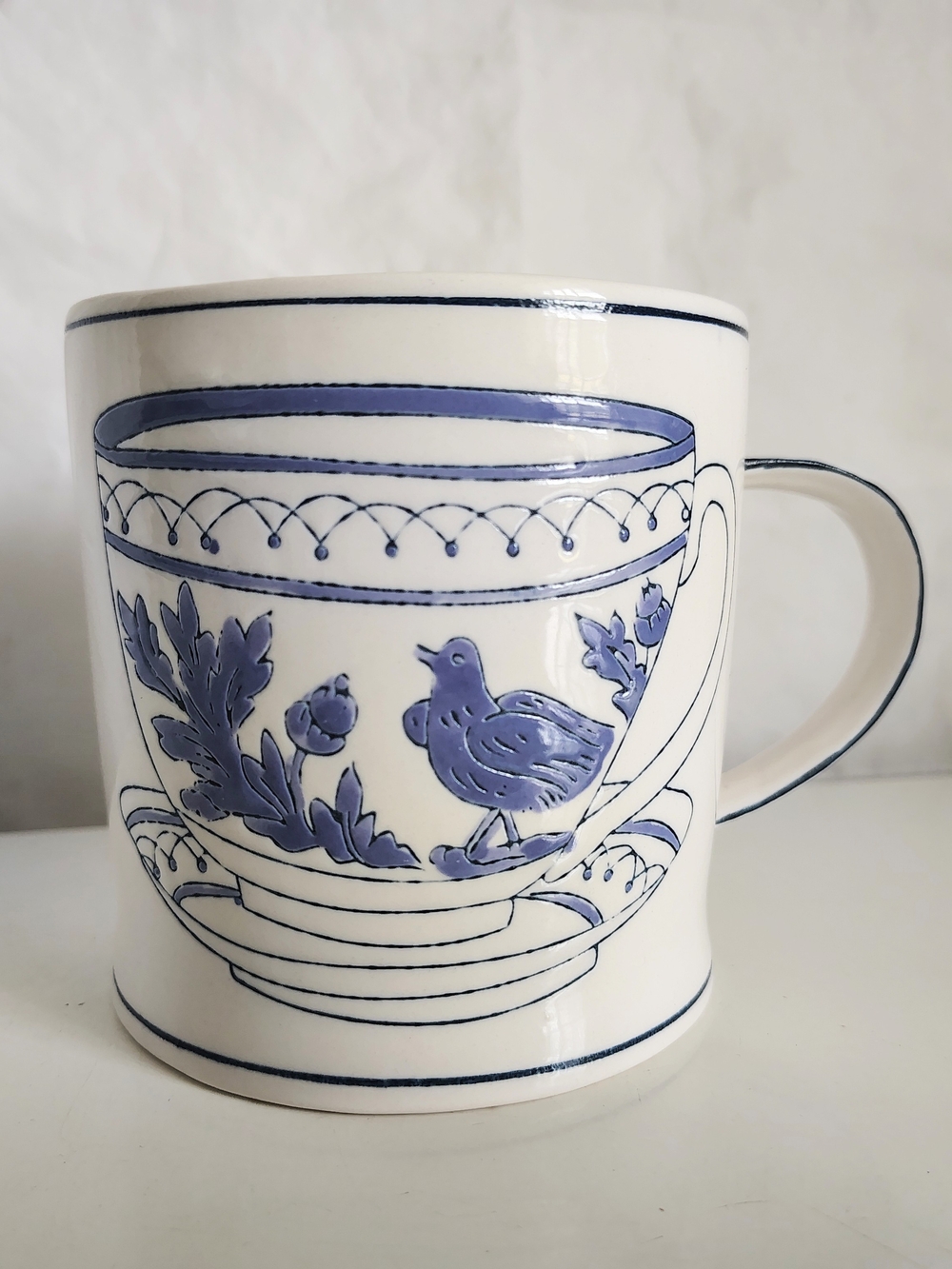 Anthropologie Molly Hatch White Mug with Blue Bird and Floral Motif 13 Ounce